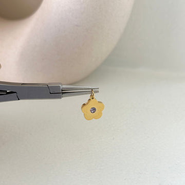Flower with stone charm