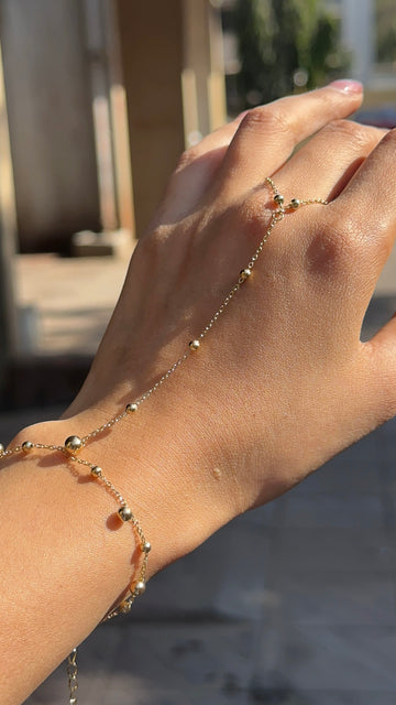Golden beaded hand chain bracelet